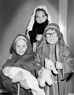 Three children in a nativity play