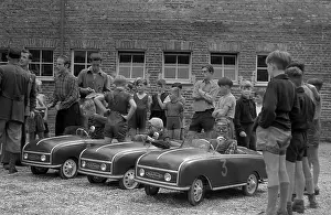 Pieck: Children in pedal cars