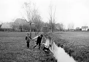 Separated: Children play at the Ossa border river, 1939