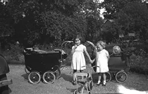 Prams: Two children play with prams