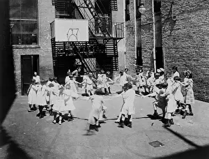 Neighborhoods: Children play ring-around-a-rosy in a settlement