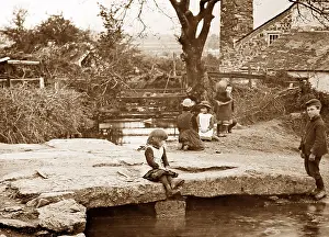 Dartmoor: Children playing on a clapper bridge on Dartmoor