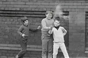 Firework: Children playing with fireworks in street
