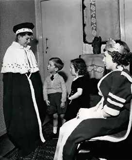 Studded: Children playing a game of Coronations