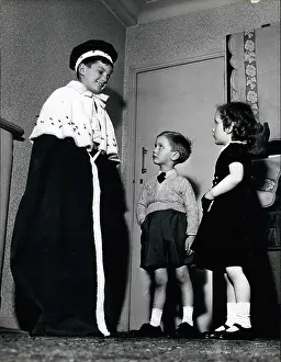 Studded: Children playing a game of Coronations