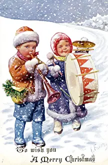 Christmassy: Children playing instruments in the snow