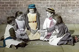 Knuckle: Children playing Jacks