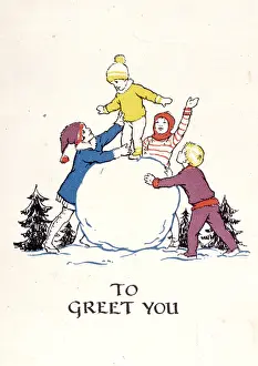 Snowballs: Four children playing with a large snowball