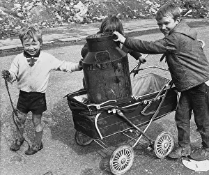 Churn: Children playing with milk churn and pram