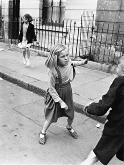 Gutter: Children playing in Portland Road