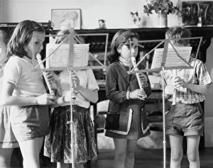Quartet: Four children playing recorders