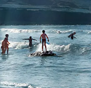 Children playing in the sea