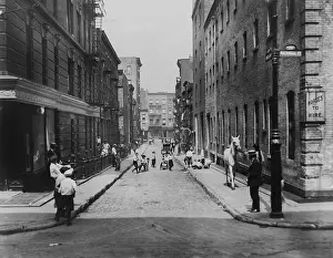 Tenements: Children playing in the street on Minetta Lane