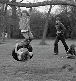 Tony Boxallfrps: Children playing on a tyre swing
