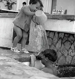 Tony Boxallfrps: Children playing with water on holiday