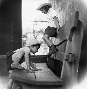 The John Krish Collection: Two children playing on a wooden bench