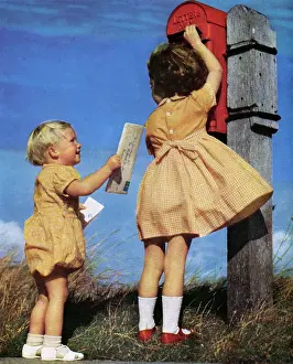 Postbox: Children posting a letter