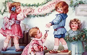 Four children putting up Christmas decorations