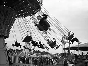 Skelter: Children ride a carousel