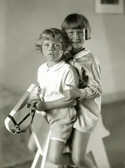 Rocking: Children on a rocking horse, 1930
