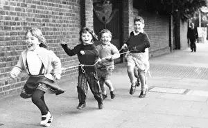 Waists: Children running with string, Balham, SW London
