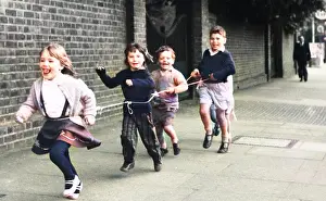 Waists: Children running with string, Balham, SW London