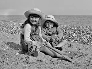 Pebbly: Two children at the seaside