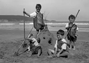 Sandcastle: Four children on a seaside holiday