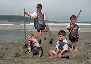 Sandcastle: Four children on a seaside holiday