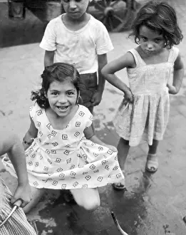 Curtsey: Three children in southern Italy