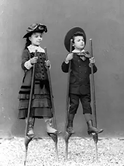 Alinari: Children on stilts, 1870s