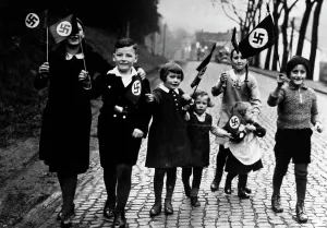 Parenting: Children with swastika flags, 1933