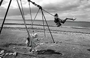 Swings: Children on swings, Arran, Scotland