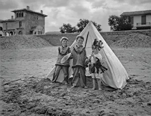 Wigwam: Three children with tent on a beach