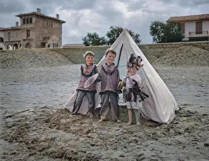 Wigwam: Three children with tent on a beach