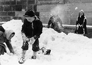 Children throwing snowballs in Vienna 1954