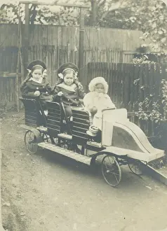 Feb21: Children in a toy car