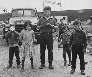 Wasteland: Children and vehicles on waste ground