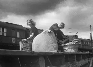 Belongings: Children wait on a platform, 1945-1949