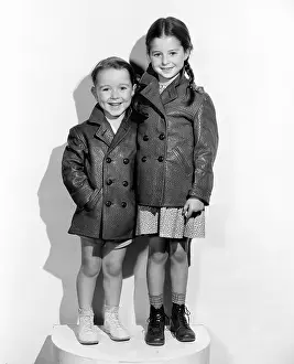 Uniformity: Two children wearing jackets