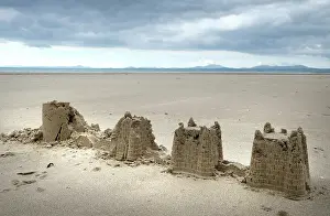 Snowdon: Child's abandoned sandcastles at low water on Harlech beach