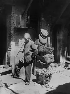 Magua: Chinese man smoking long pipe in Rag Pickers