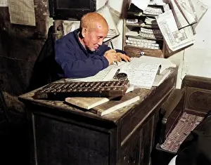 Abacus: Chinese Man Writing Ledger Using Abacus Bookkeeper