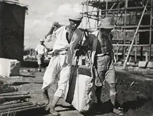 Lcgr1411: Two Chinese men work together to life a large