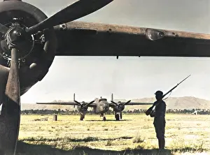 Chinese sentry guards American bomber