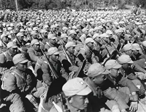 Tntarlcgr: Chinese soldiers seated in rows equipped with