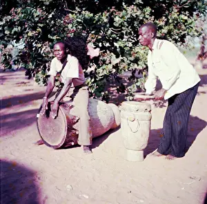 Chopi: Chopi men playing drums. Drum on left is called Chikulu