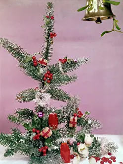 Dusted: Christmas arrangement of tree, holly and candles