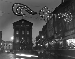 Mopeds: Christmas decorations and bank, Penzance, Cornwall