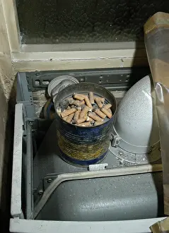 Butts: Cigarette butts in a tin